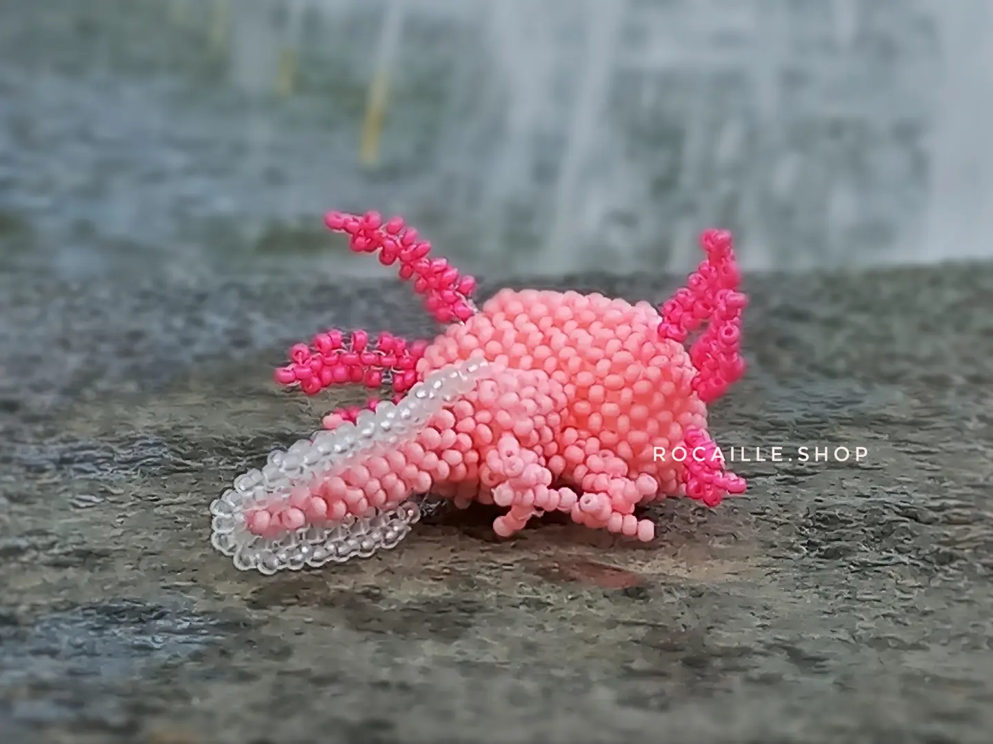 Pink Axolotl made of beads back view