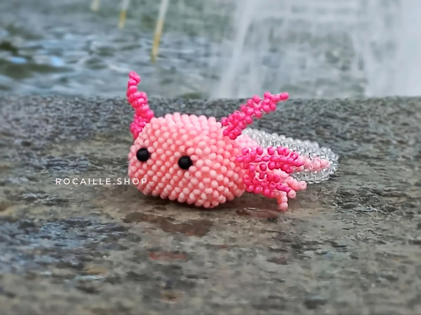 Pink Axolotl made of beads front view