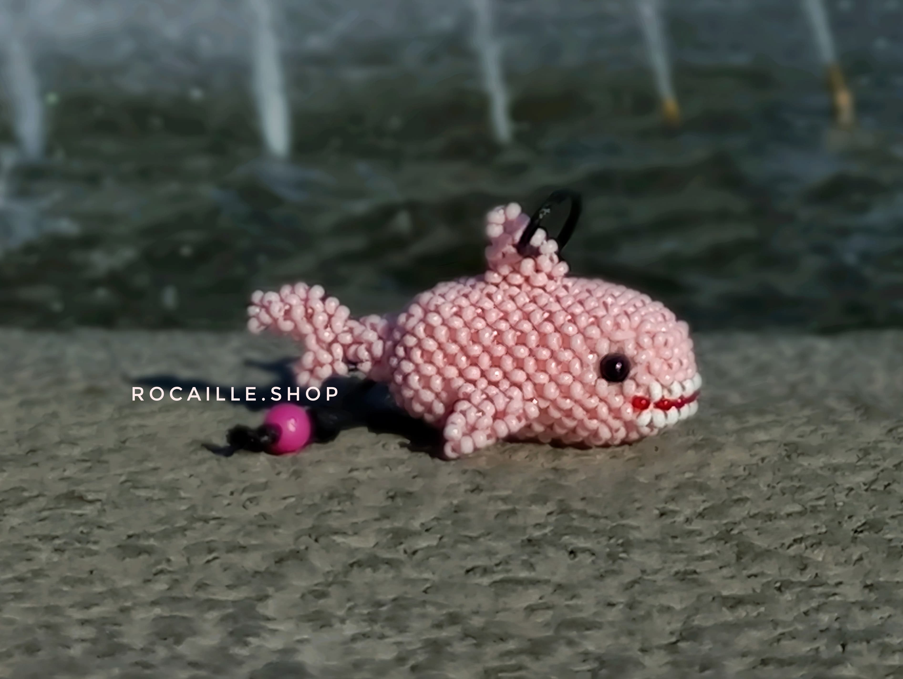Pink Axolotl made of beads side view