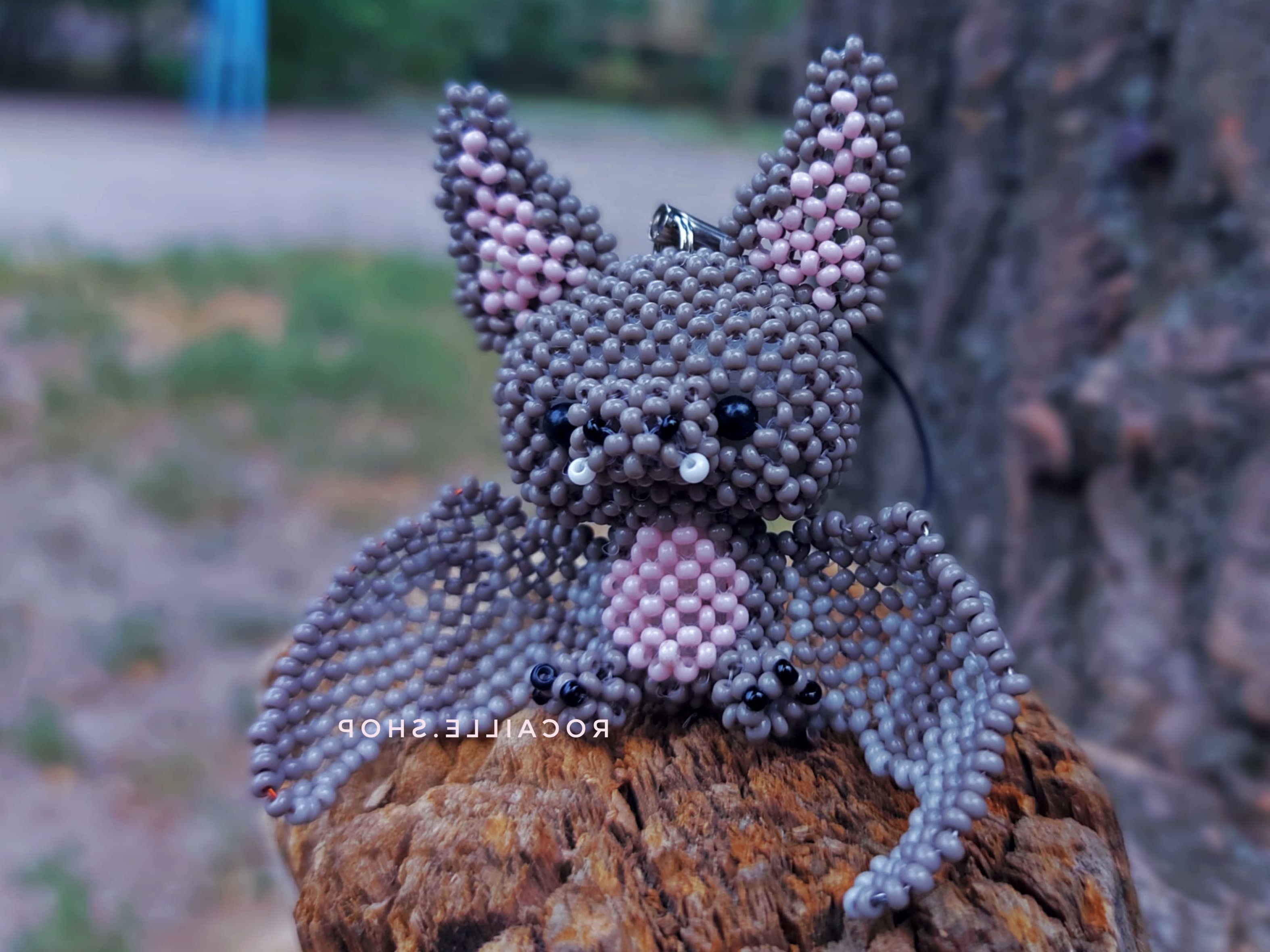 Dark bat made of beads front view